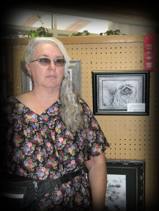 Yolanda Martin at Art show with winning entry